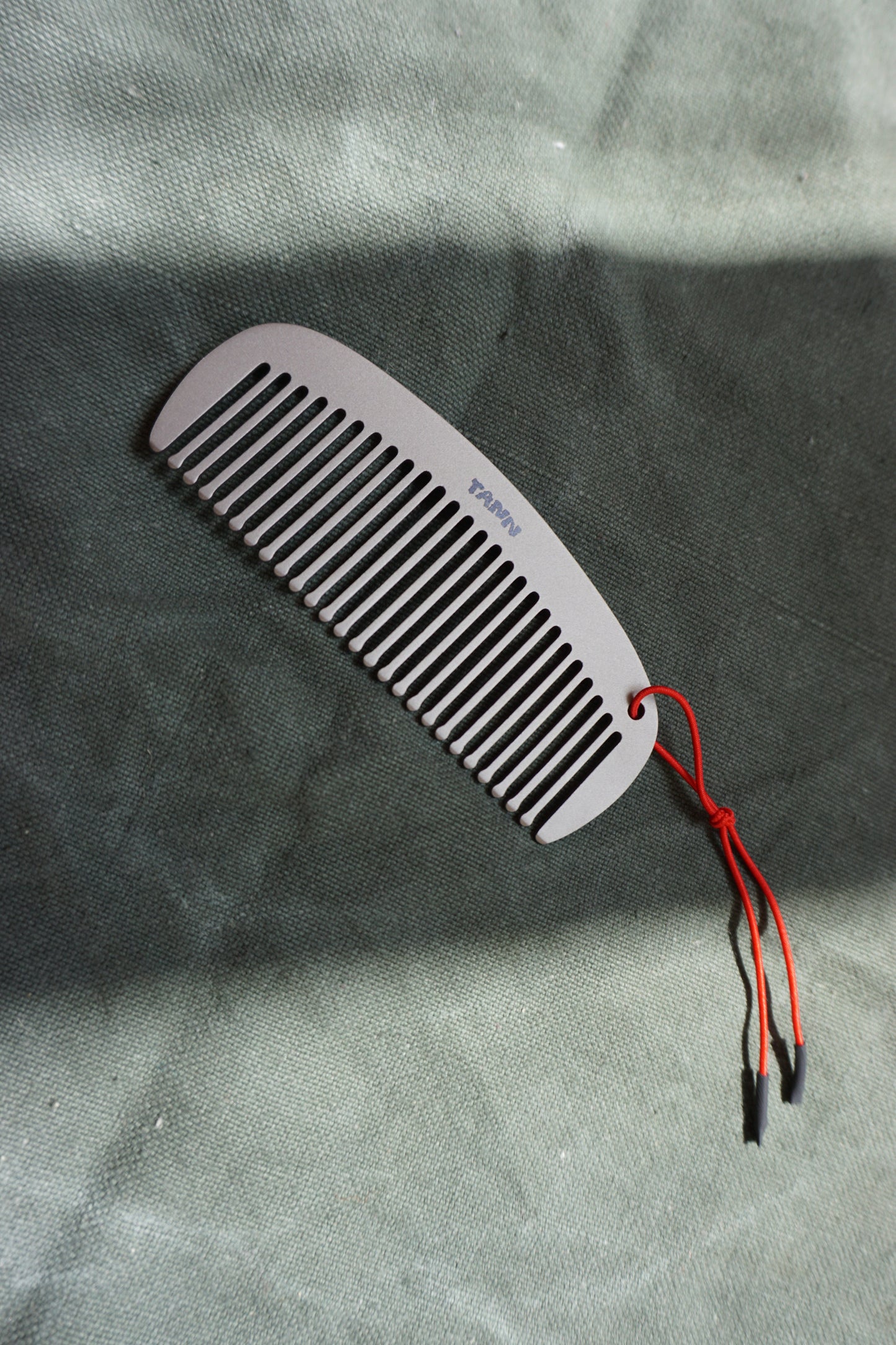the TANN titanium comb