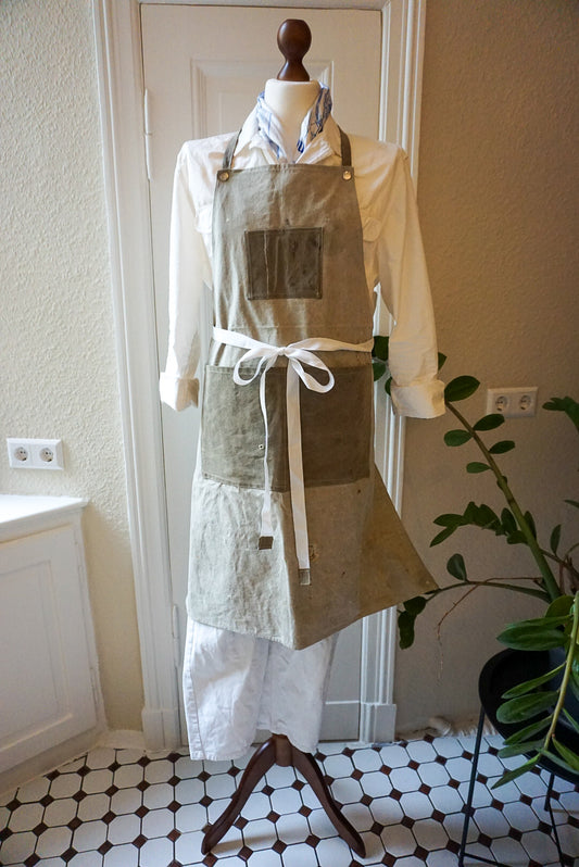 Mannequin wearing a beige apron made of US Army WW2 Tent fabric. Photo by TANN.